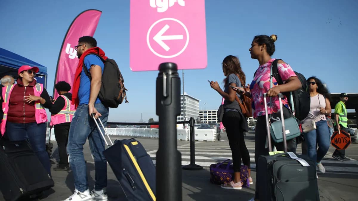 Arriving passengers wait to board Lyft vehicles at Los Angeles International Airport