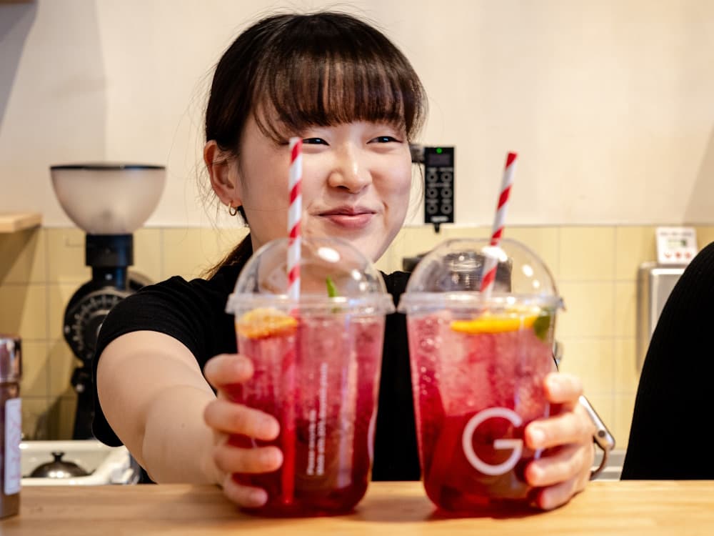 Barista Serving Drinks