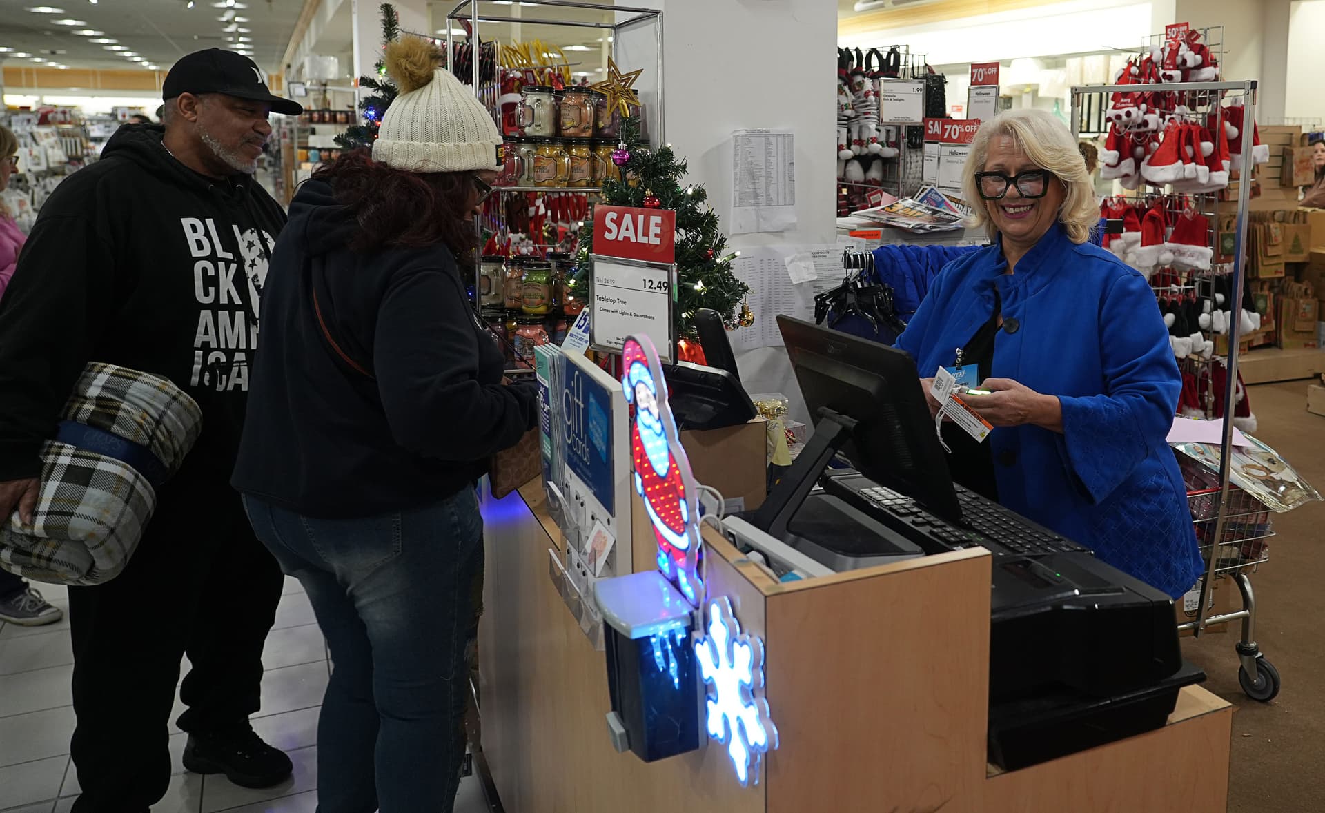 Zora Sawyer, Store Manager at the Boscov's in Christiana, rings up a customer on Nov. 28, 2025.