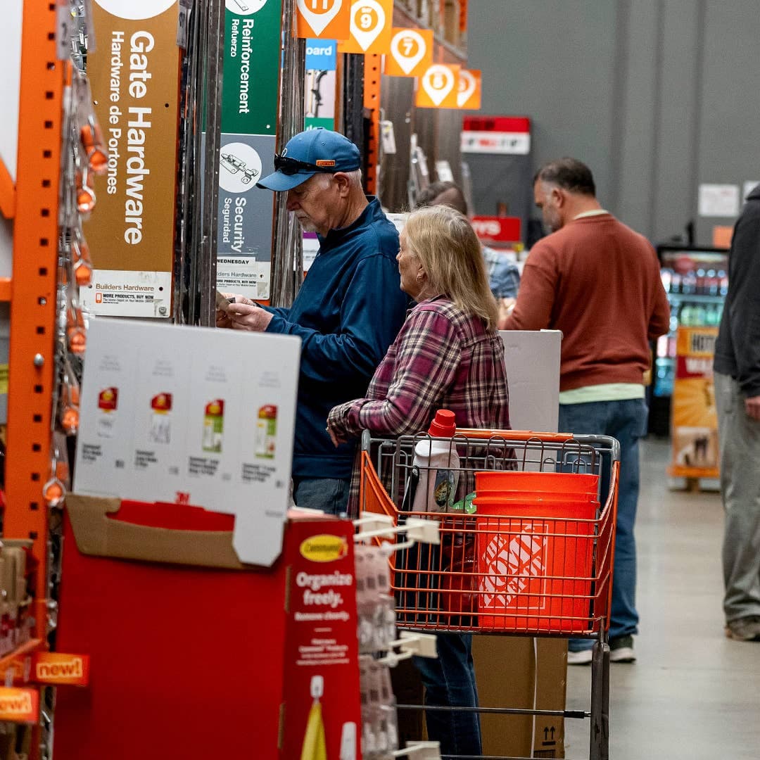 Customers shop in a Home Depot Home Improvement Supply retail Store.